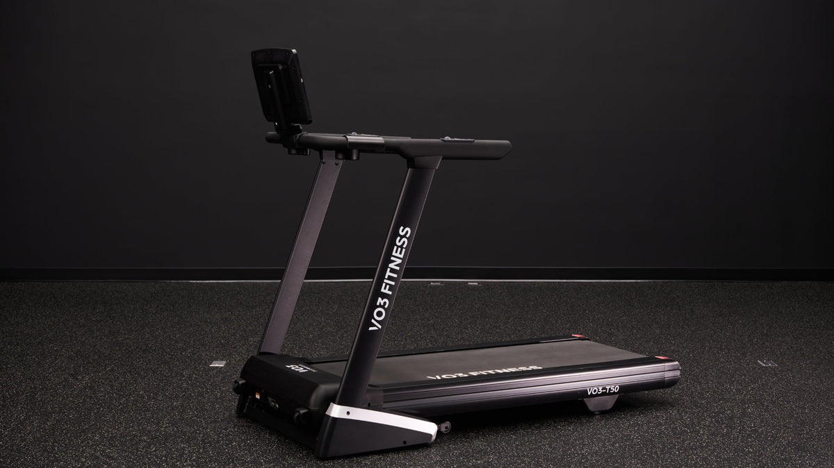 VO3 Fitness folding treadmill in a dark studio