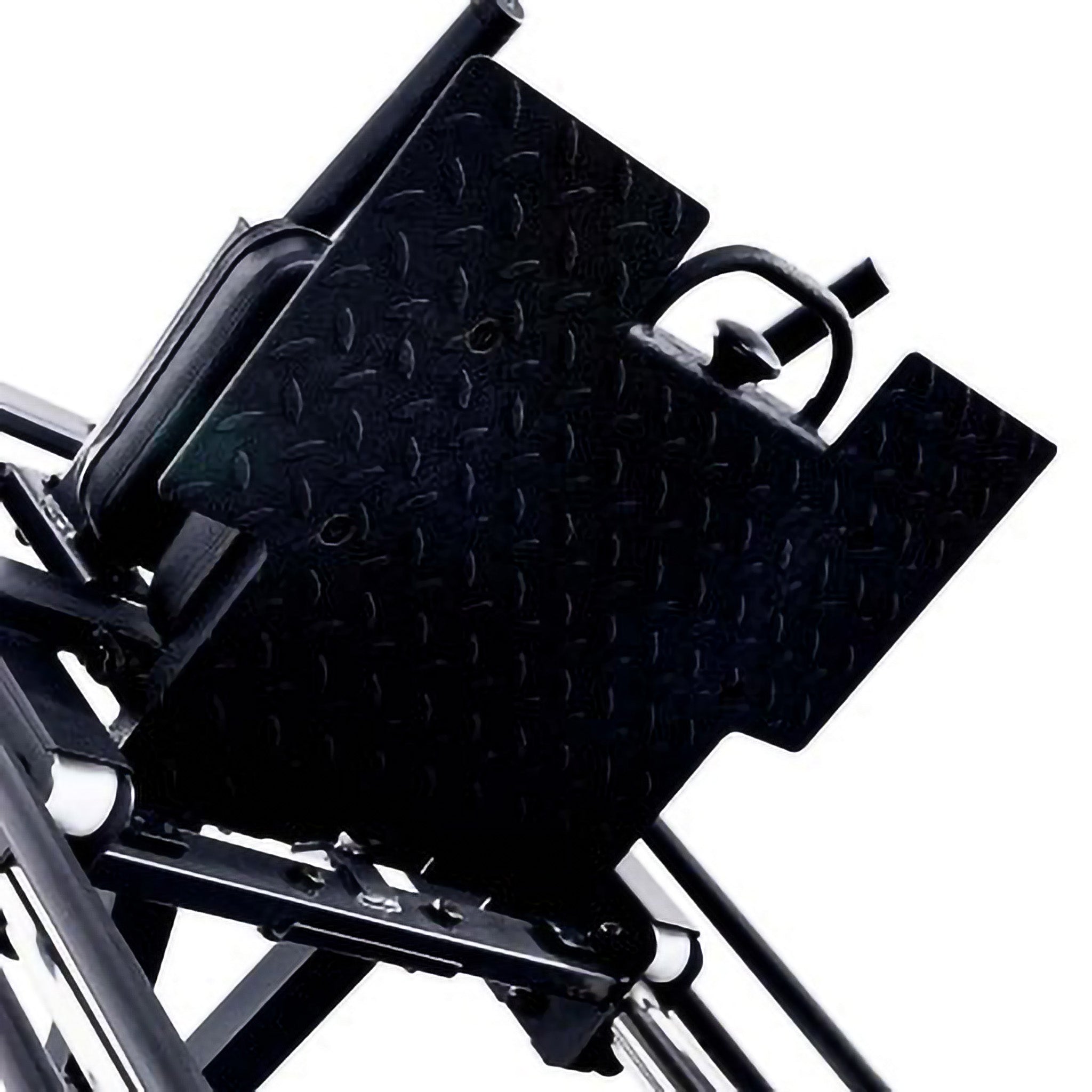 Close-up of textured diamond plate foot platform on a hack squat machine with ergonomic handles and secure foot positioning