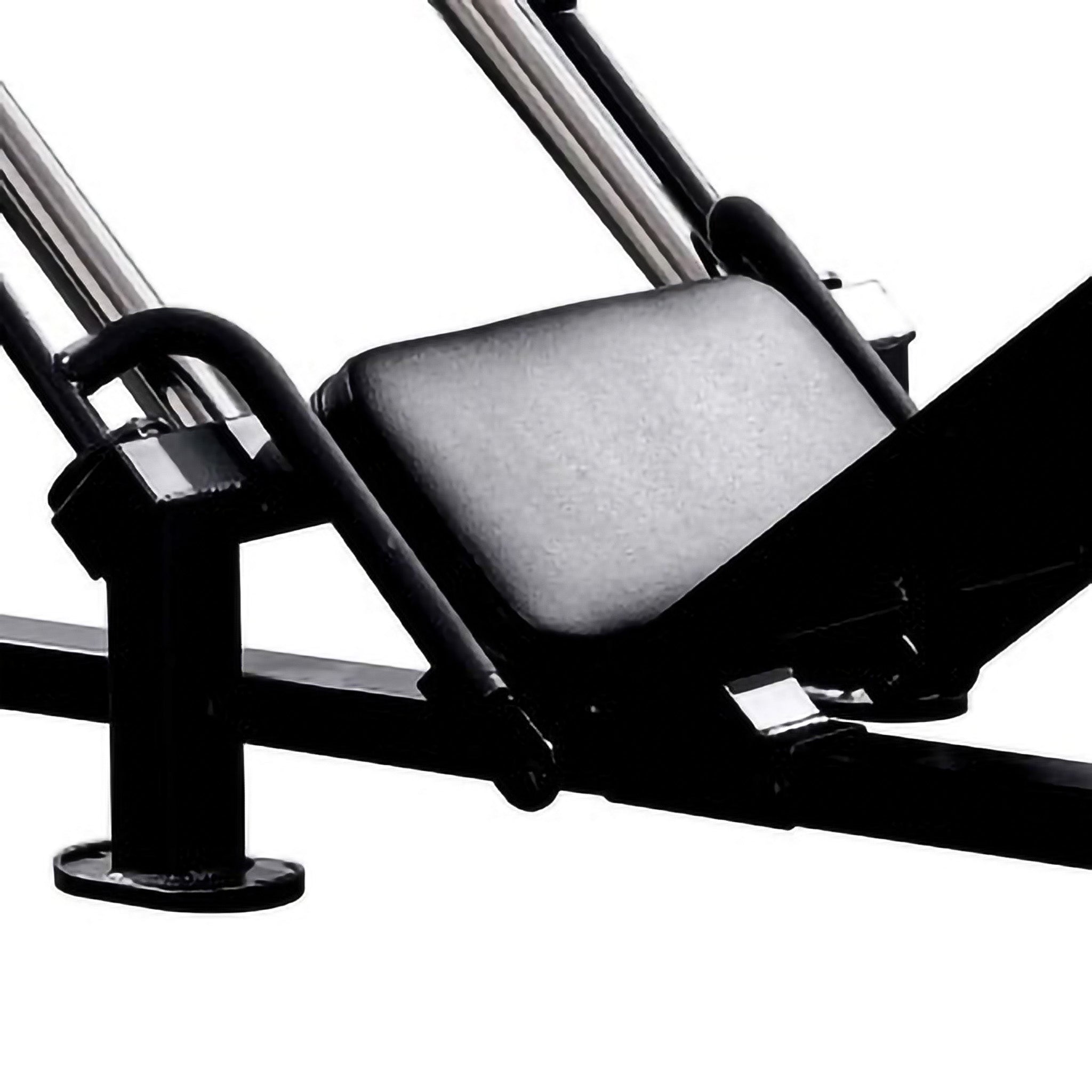Close-up of the padded backrest on a leg press machine, designed for comfort and support during lower body workouts