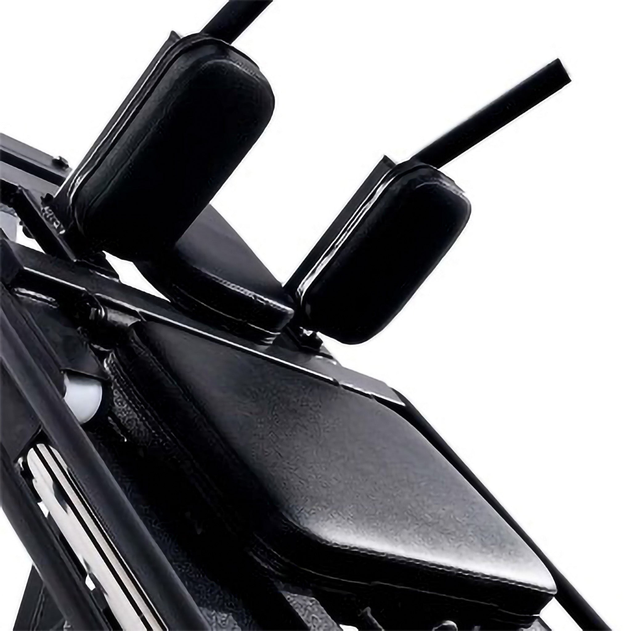 Close-up of padded backrest, shoulder supports, and handles on a leg press and hack squat machine for comfort and stability during workouts