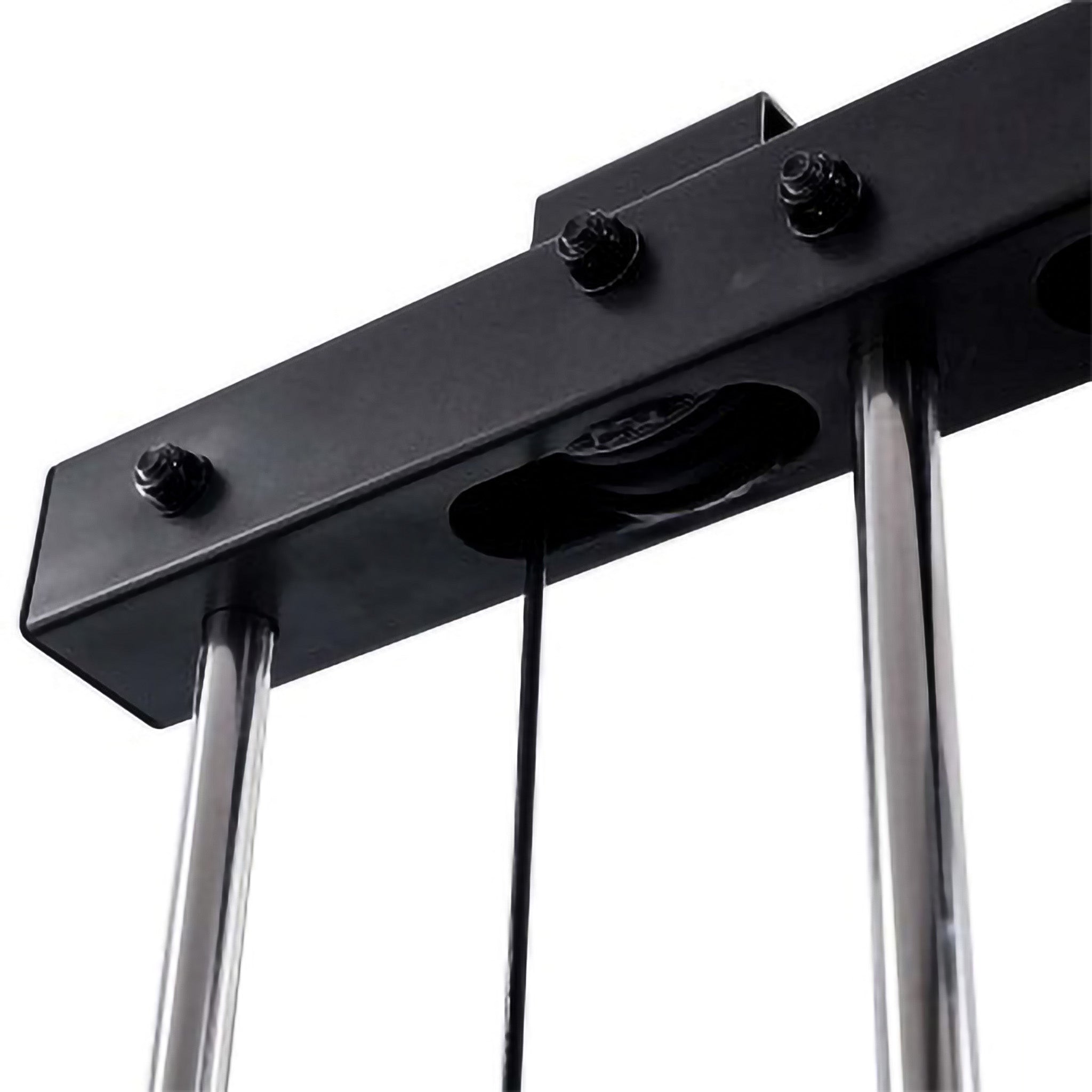 Close-up of a dual pulley system on fitness equipment, featuring black cables running through a double-groove pulley wheel mounted between metal frame bars.