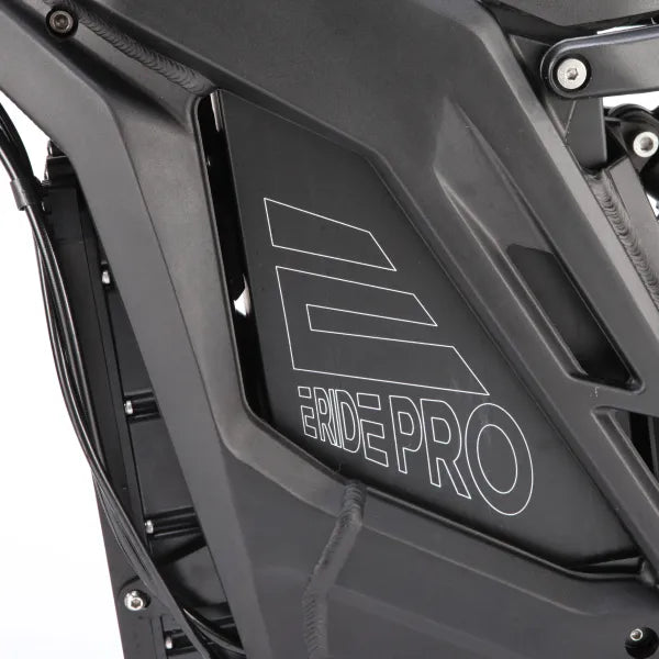 Close-up of a black motorcycle with 'Ride Pro' branding on a white background