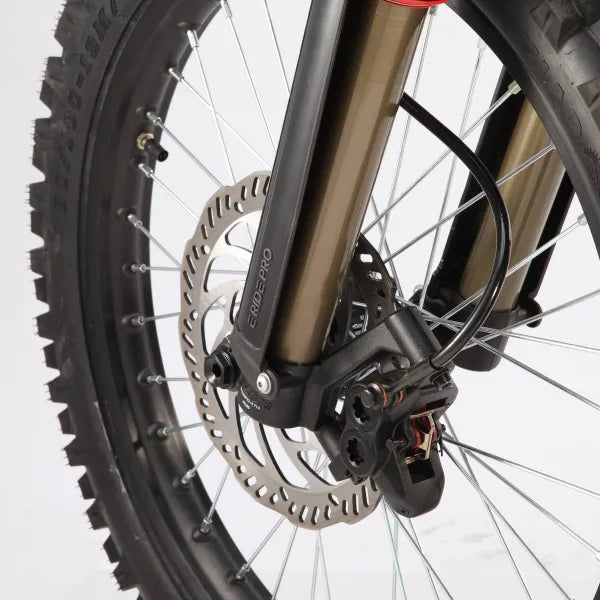Close-up of a bicycle wheel with disc brake system on a white background