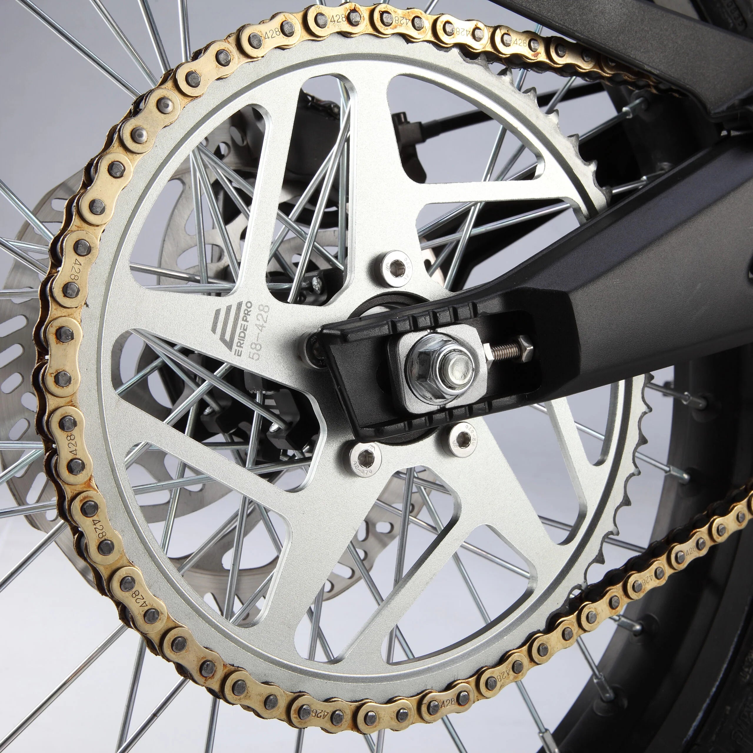 Close-up of a motorcycle chain and sprocket system