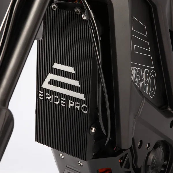 Close-up of a black mechanical component with 'RIDE PRO' branding on a white background